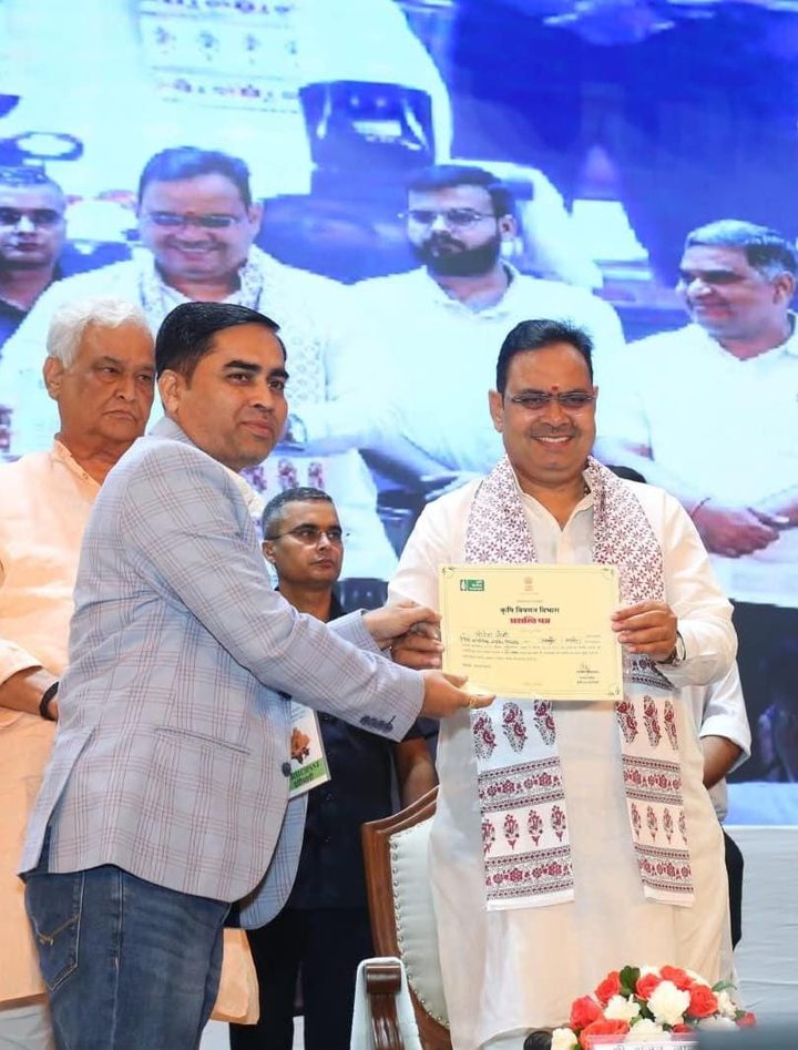 Rapid Organic receiving a certificate of appreciation from the Agriculture Department on stage